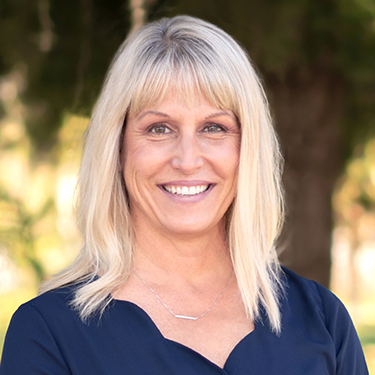 Barbara in front of trees
